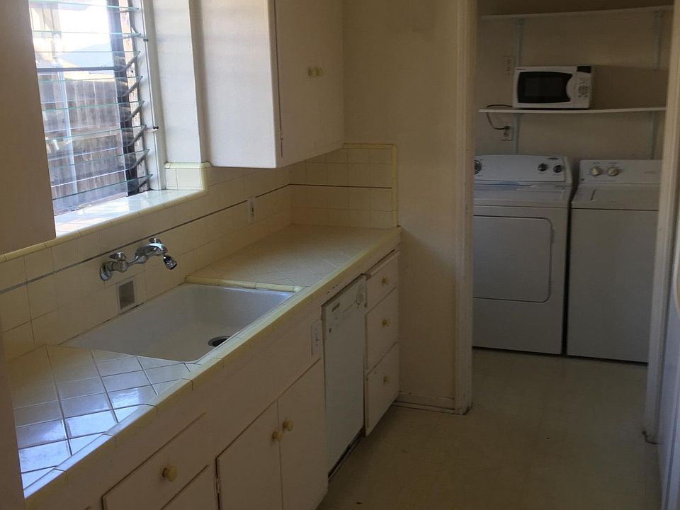 Kitchen & service porch (washer & dryer not included)