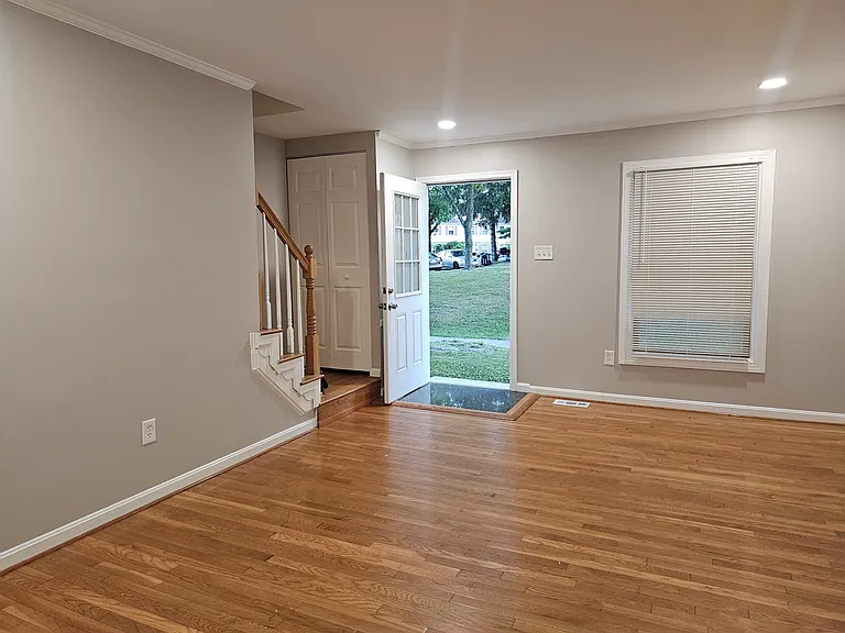 Living room and front entrance with beautiful hardwood floors!