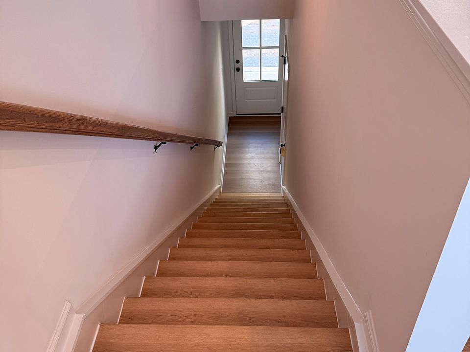 Stairs from first floor coming from the front door.