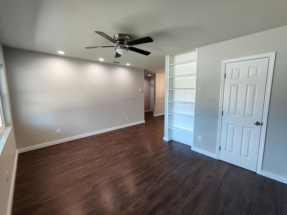 Living Room with closet and built-in bookshelf