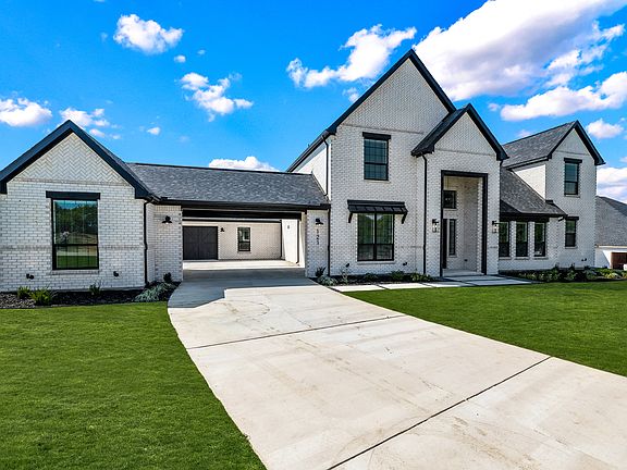 Imagine driving up to this stunning home every day - the butterflies will never disappear.