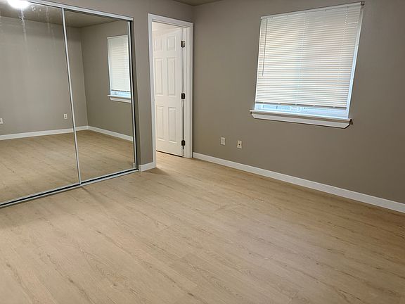 Master bedroom with mirror closet door