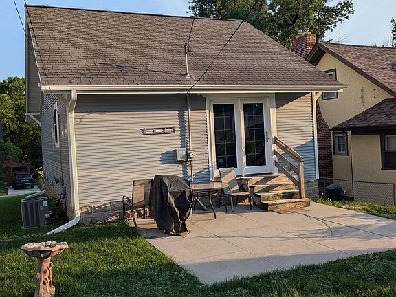 Back of house with nice patio space and patio table included.