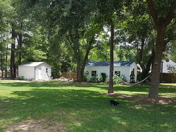 Fenced backyard with shop 