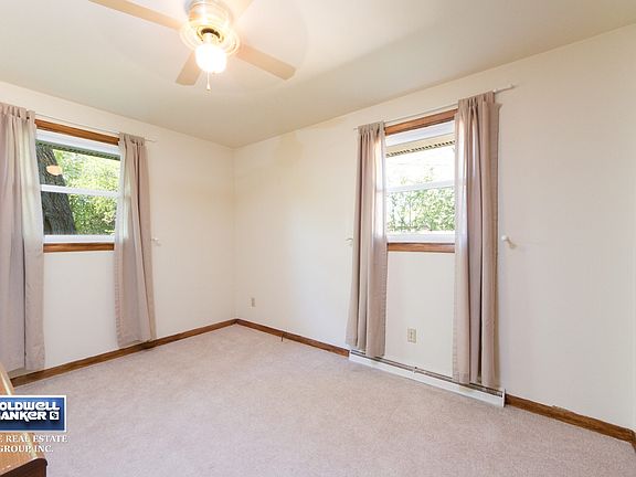 Master Bedroom Has Lighted Ceiling Fan