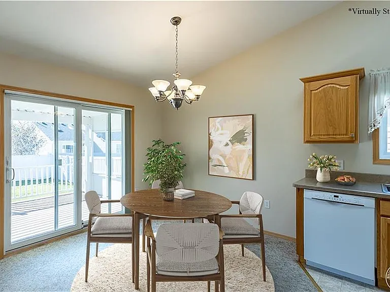 Staged Dining room, looks to covered patio