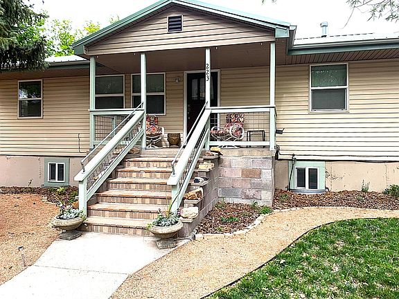 Front porch and easy-care landscaping and collection of fascinating rocks!.