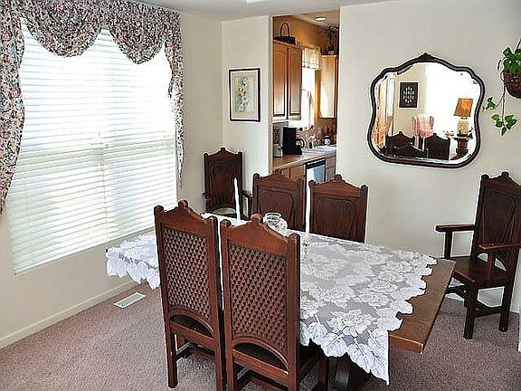 Great open dining room with try ceiling!