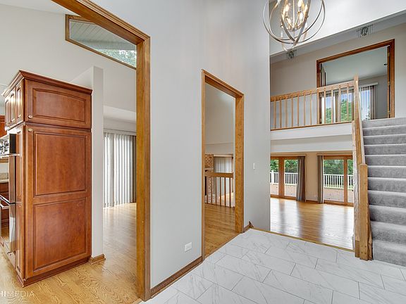 Greet your guests in the 2 story foyer with skylight.