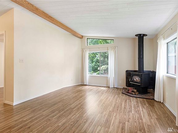 Walk into this huge open floor plan with brand new flooring & fresh paint throughout. Cozy up to the wood burning fireplace during those long cold winter days. 