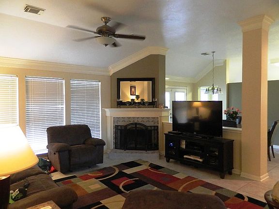 Open living and dining areas, notice the high ceilings.