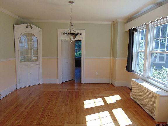 Recently painted, chair rail, refinished hardwood, measures 13' x 13'