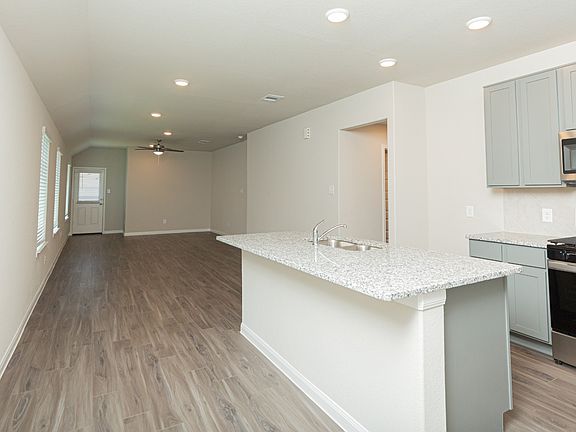 Dining Area and Kitchen to Family Room