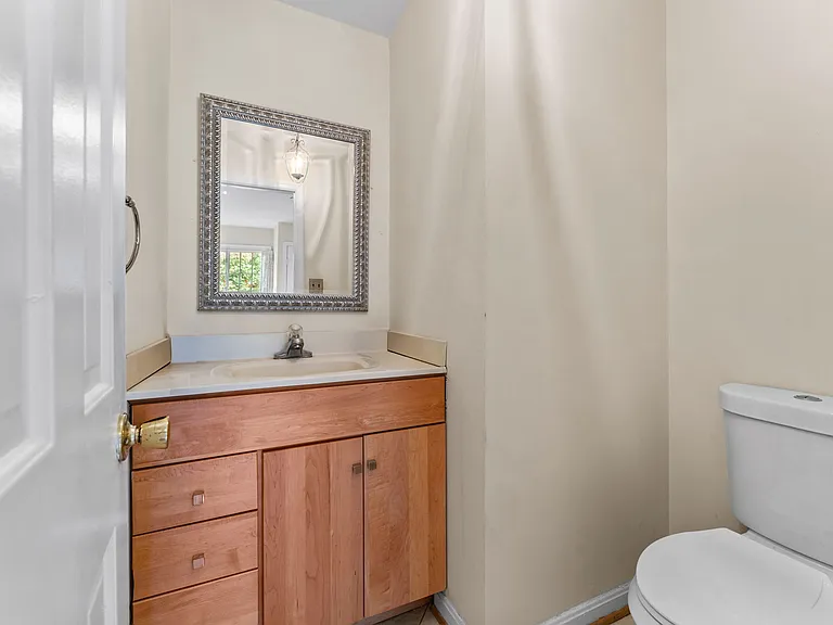 Powder room located in foyer.
