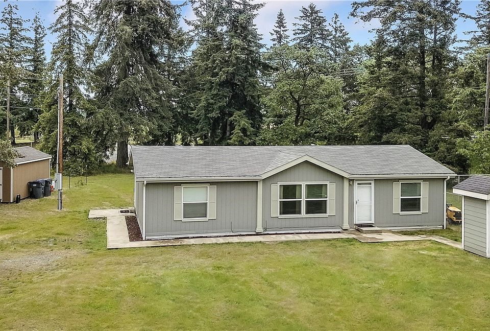 Front view of home, drive and nice shed on left, well pump house on right. 