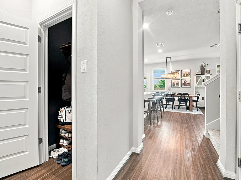 Built in shoe closet & coat rack in front hallway