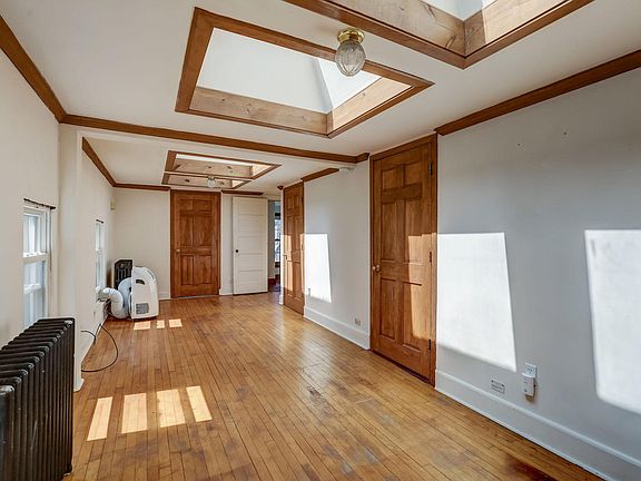 Another shot of the den. Portable AC and radiators NOT needed anymore - new central heat and air installed!