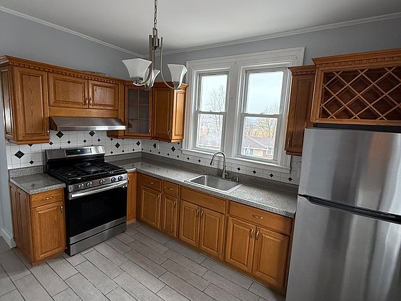 kitchen with stove and fridge