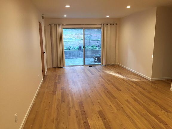 Large Family Room with slider to private back yard and newer flooring.