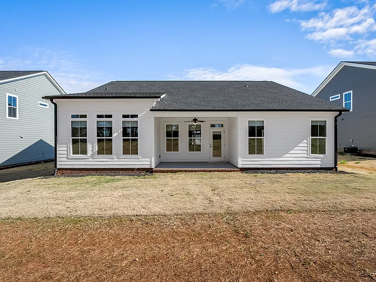 View of backyard and the back of the home.