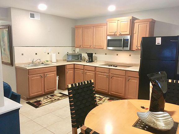 Fully stock kitchen with dishes, silverware, pots and pans, storage containers. Full size refrigerator, garbage disposal, large cook top (no oven), and large toaster oven.