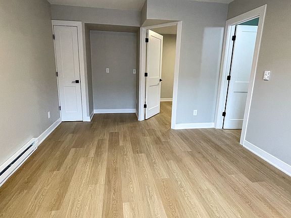 Living area with closet and entertainment center