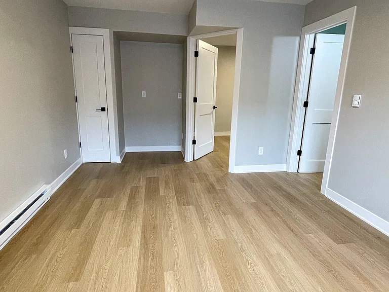 Living area with closet and entertainment center