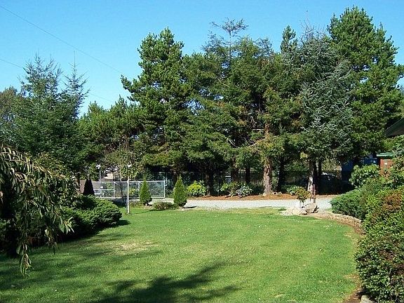 Acre is landscaped, front lawn is on sprinklers