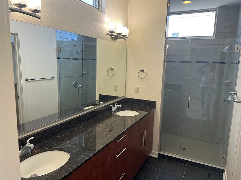 Primary bathroom with double vanity and ample storage