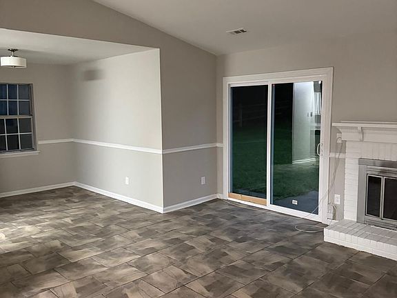 Access to the expansive backyard, perfect for family activities, BBQs, or simply relaxing outdoors.
