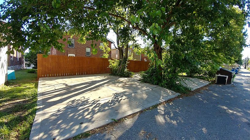 Newly redone Huge back parking pad area with a private Off Street parking spot for each tenant!