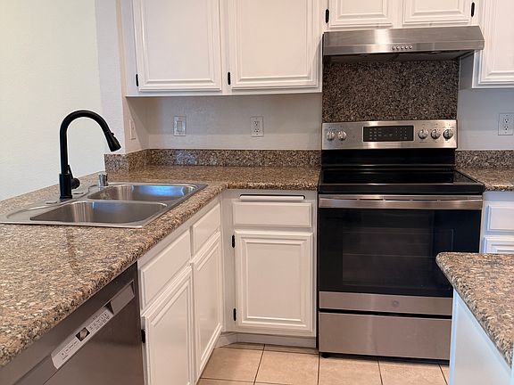 Kitchen with new appliances/fixtures