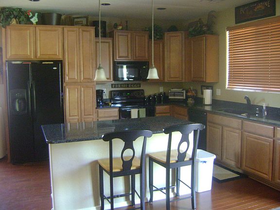 Kitchen with Hughe Island and Quartz Countertops
