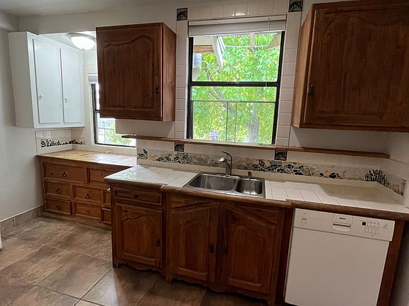 kitchen with custom cabinets and dishwasher