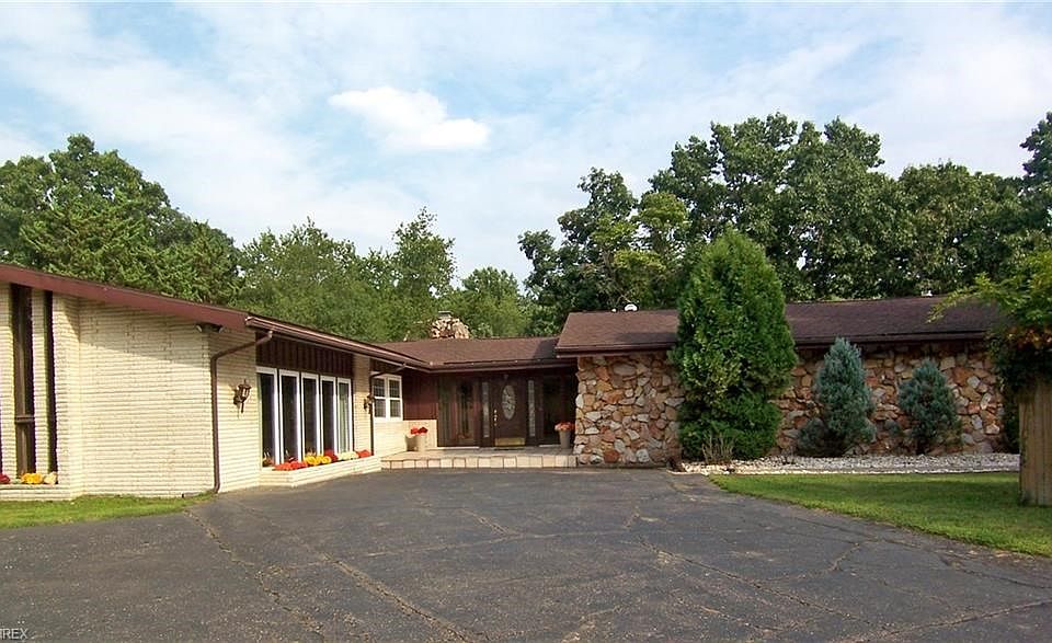 Over 6650 Sq. ft. of living space in this ranch style home with walk out basement located on 3.9 acres. The garage has a separate driveway on the back of the house.  Both driveways are on Rector Road. Located close to Parkersburg and Vienna off Rosemar Road. City water/ aerator septic system and abundance of parking