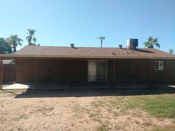 Back of house with covered patio