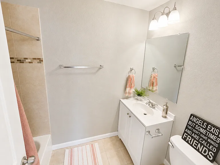 Private En-Suite Bathroom
Connected directly to the Primary Suite, this bright and modern bathroom features a full bathtub with shower, a stylish vanity with storage, contemporary fixtures, and excellent lighting for everyday comfort and convenience