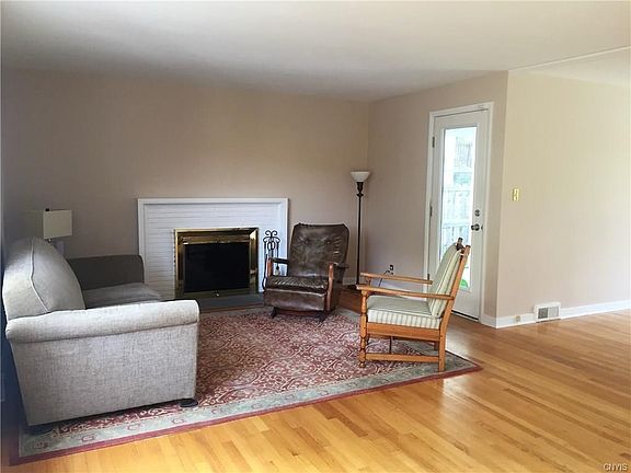 Enjoy the warmth of a wood burning fire - with the security of knowing the chimney has been repointed and cleaned. Note door that opens to screened porch and large fenced yard