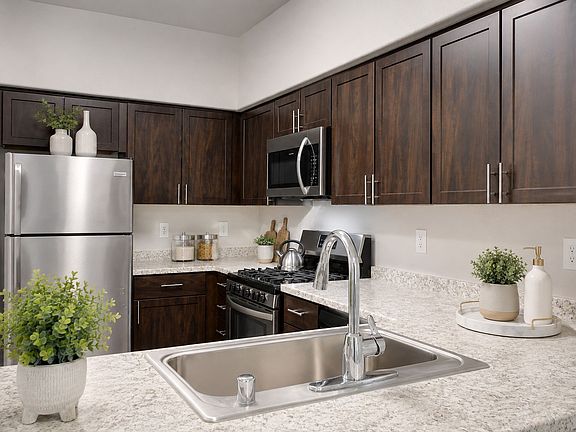 Elevate your culinary experience in the beautifully designed kitchen at Spanish Ridge. With modern appliances and stylish finishes, this space is perfect for both cooking and entertaining. Explore your future home today!