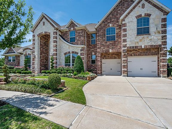Great curb appeal with brick and stone elevation and beautiful landscaping. 3 car tandem garage with epoxy floors, water softener.