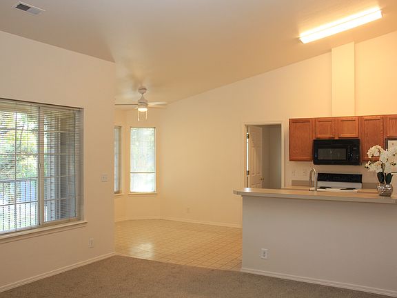 Living Room Shot from Front Door into Living Room, Dining Area and Kitchen