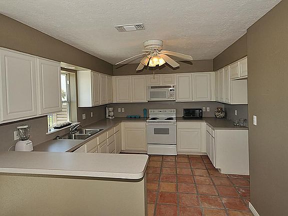 Open kitchen with breakfast bar and lots of cabinets