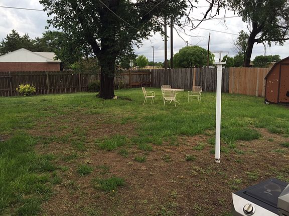 Spacious, fenced backyard.