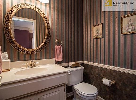 Guest half bath right off of the entry.