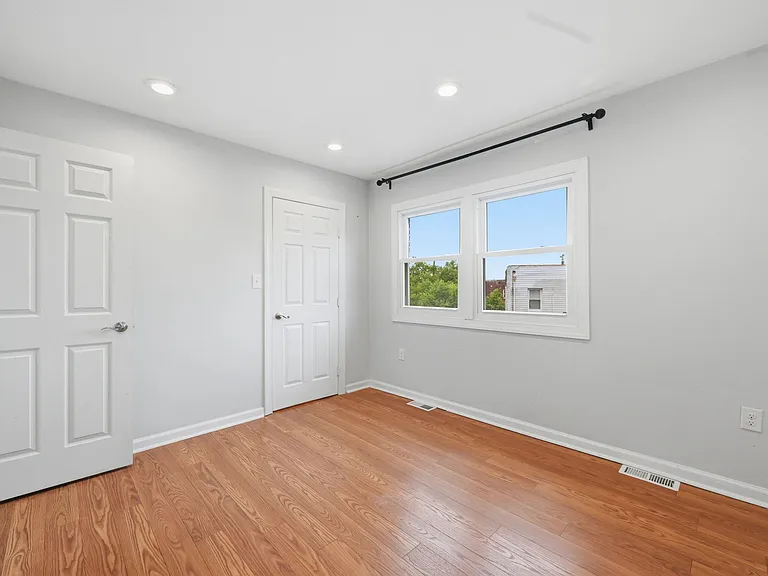 Second Bedroom with Bright Windows and Closet Space