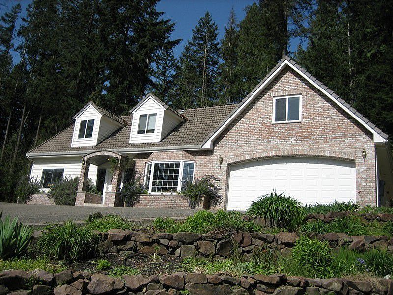 Looking up over 3-tier rock wall perennial garden