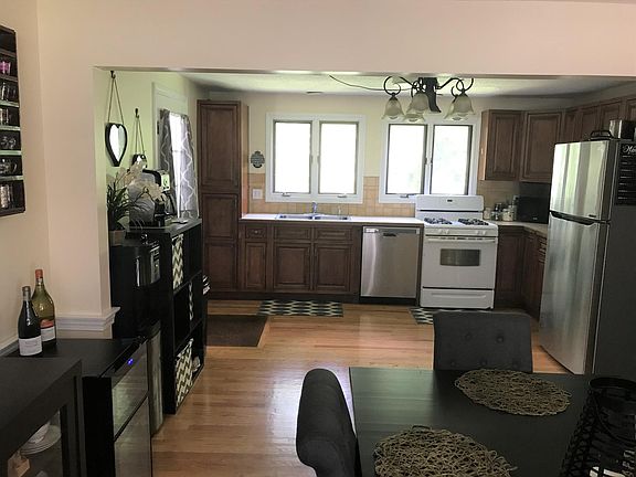 Kitchen from dining area. Side door is on the left.