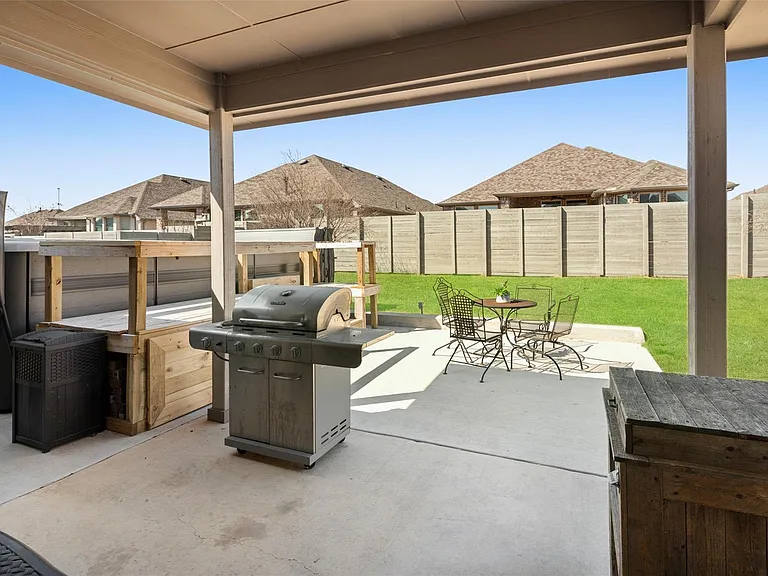 The pictures were taken while the home was occupied. None of the furniture or patio grill is included with the home.