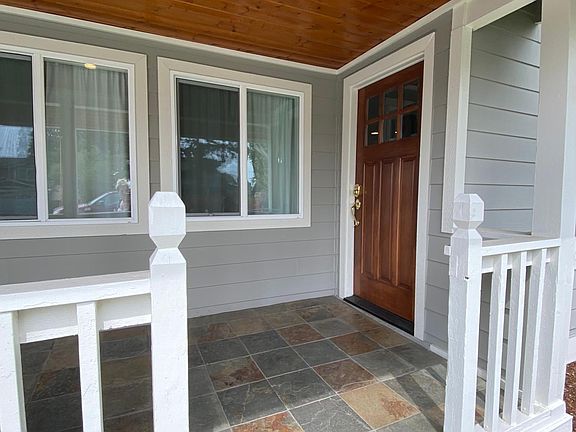 Slate front porch with recessed lighting
