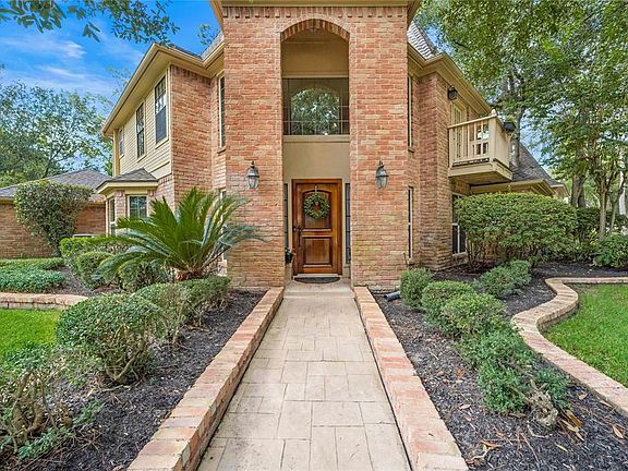 Closeup of the stone walkway and brick landscape border leading to the front entrance. Home faces northeast.